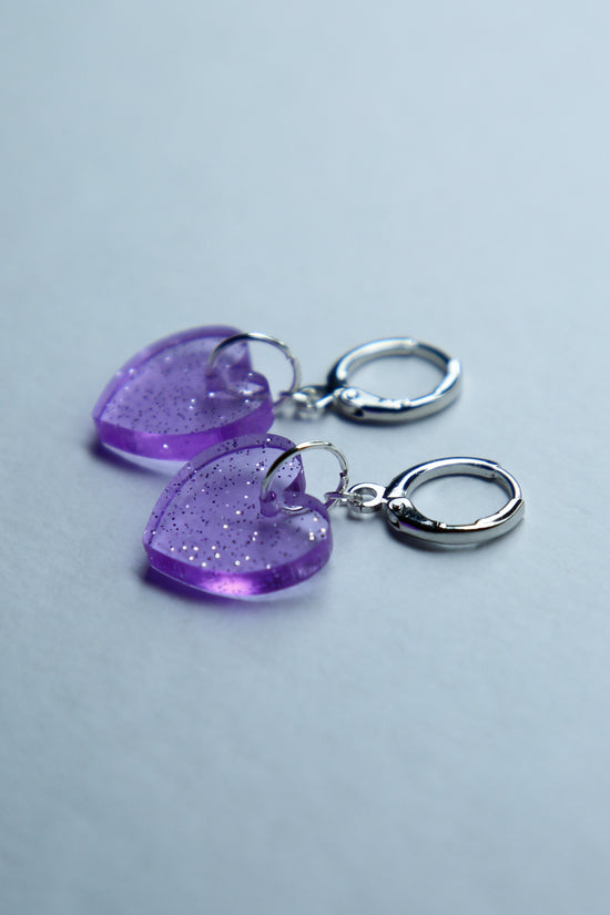 two purple heart glitter acrylic earrings