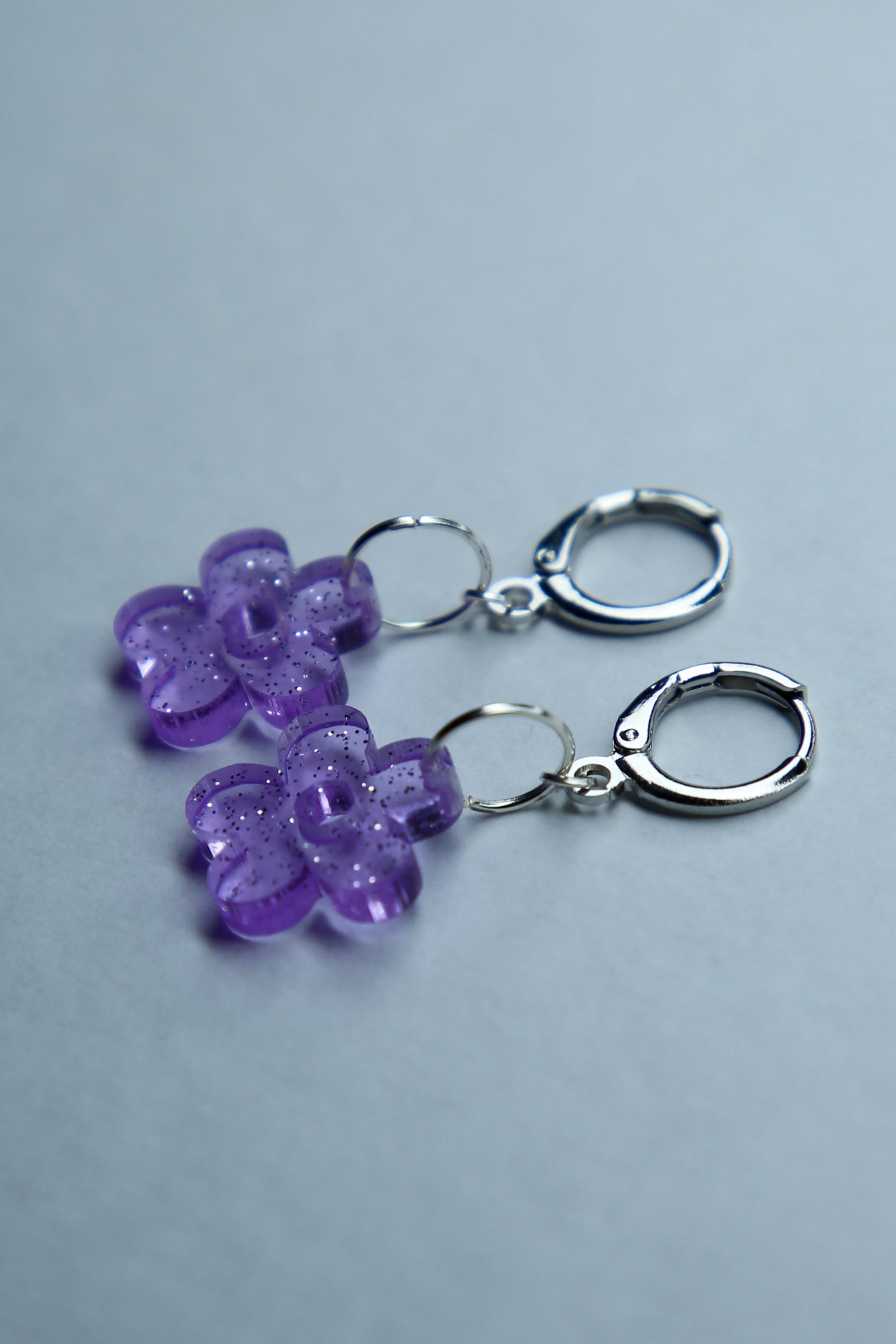 two purple flower glitter acrylic earrings