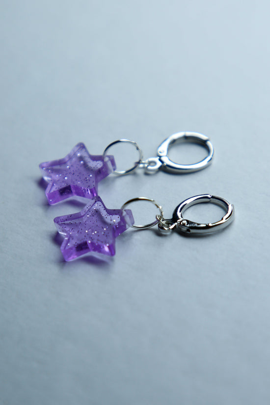 two purple star glitter acrylic earrings