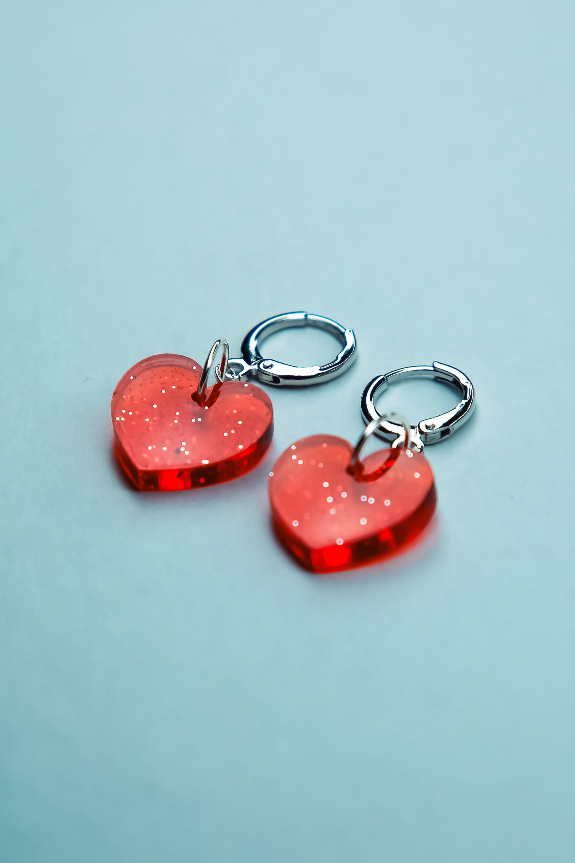 two red heart glitter acrylic earrings