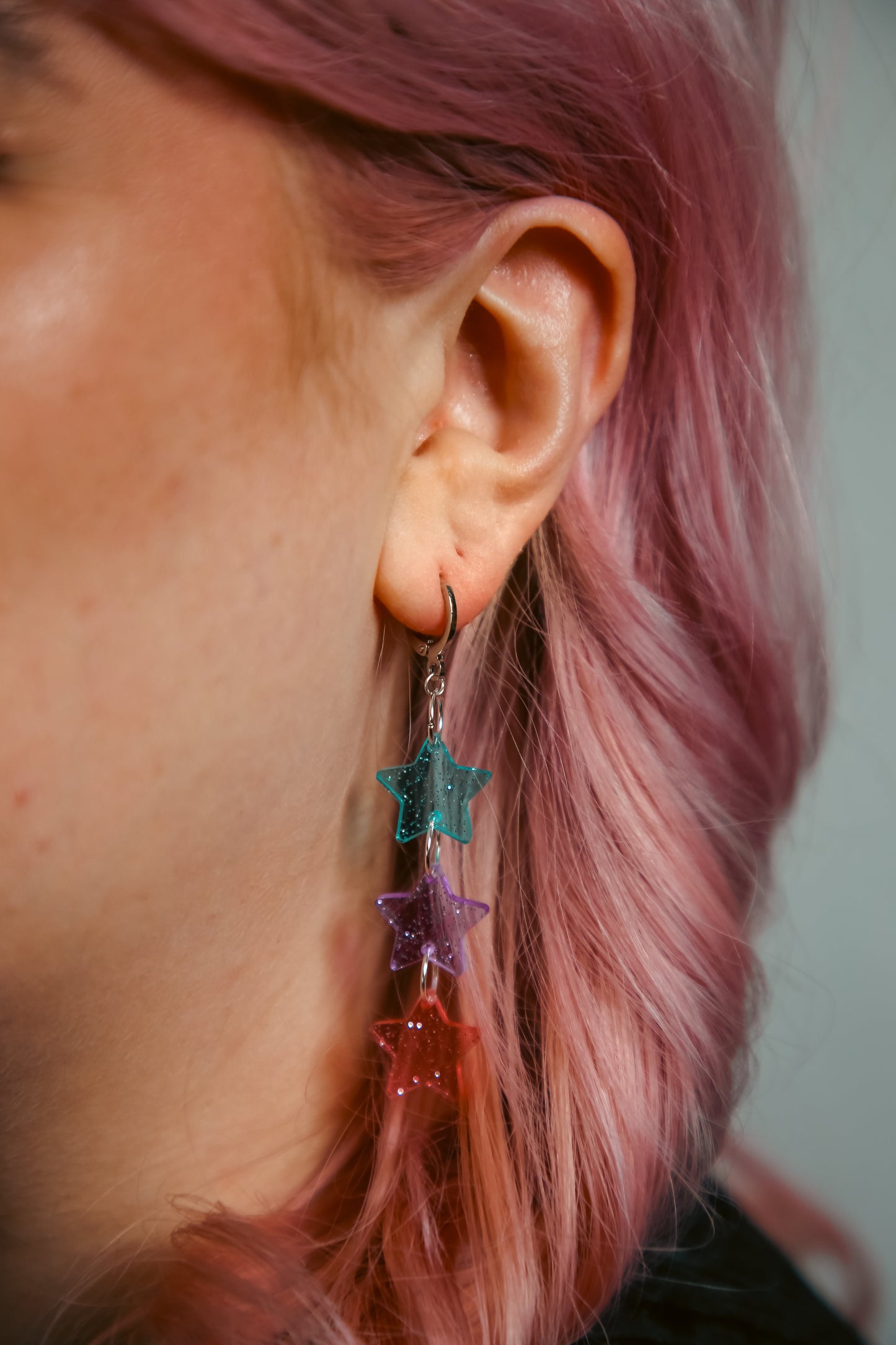 blue, purple and pink glittery transparent star acrylic earring