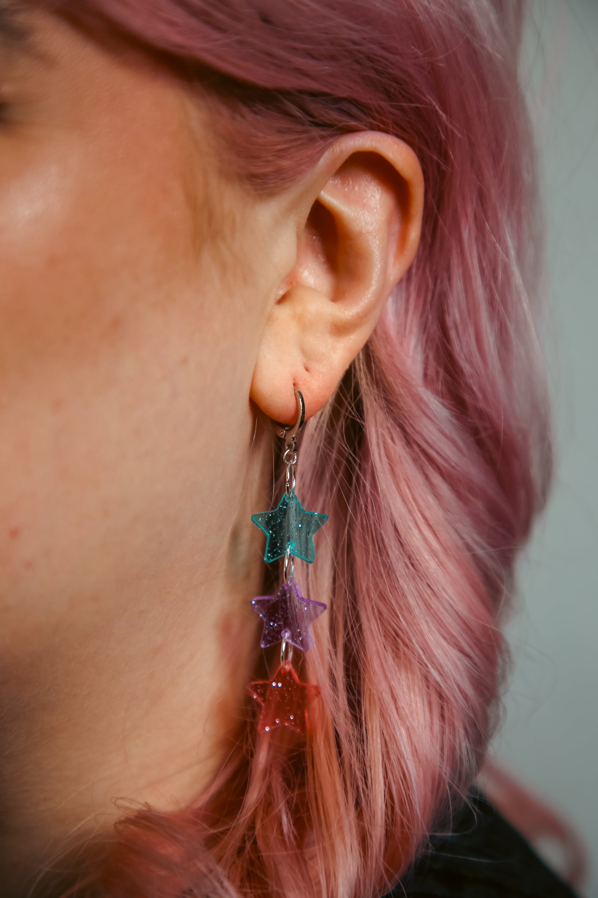 blue, purple and pink glittery transparent star acrylic earring