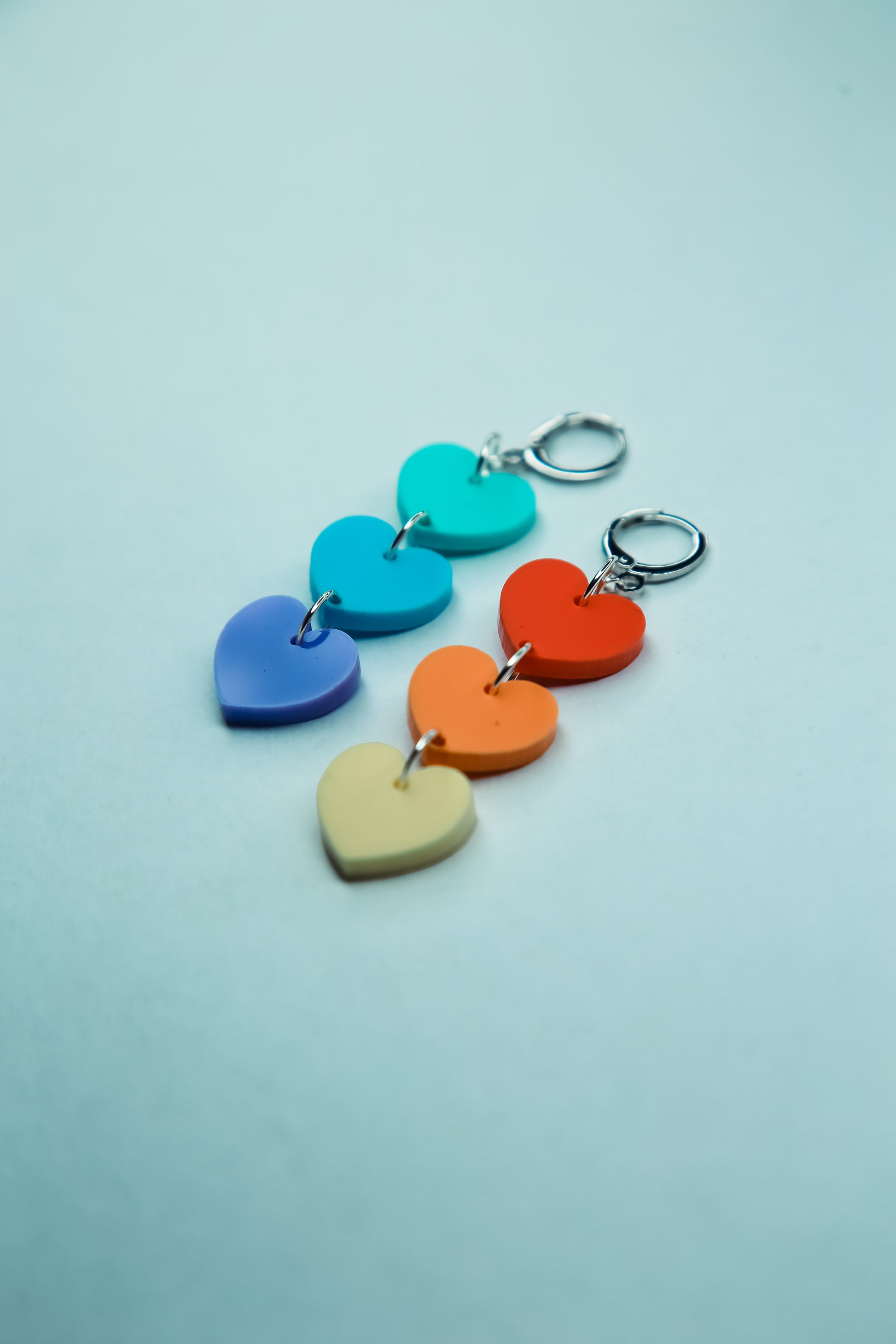 multicoloured pastel heart shaped acrylic earrings flat lay