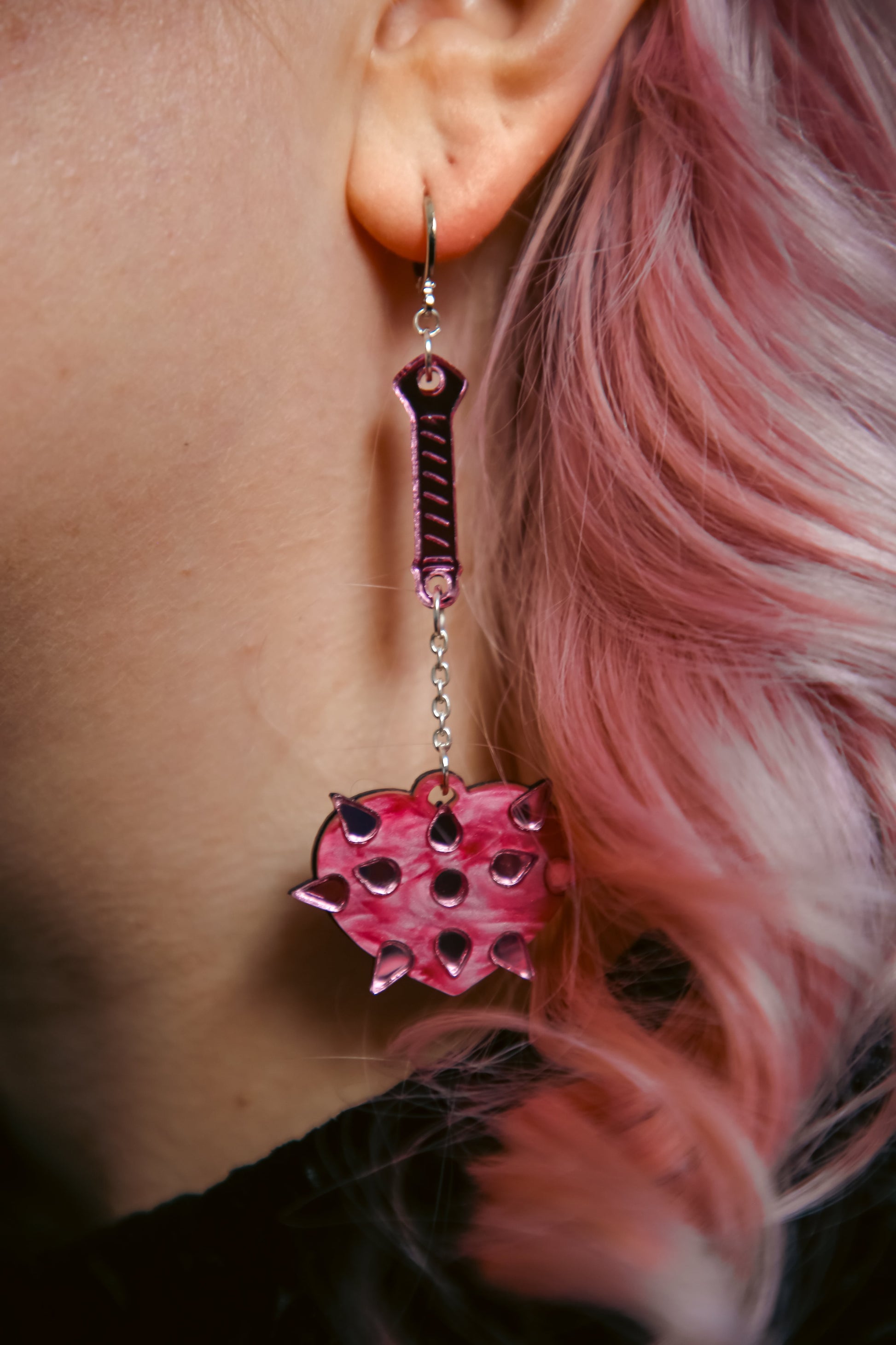 pink mace acrylic earring with pink heart shaped mace ball and reflective pink handle and spikes