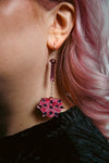pink mace acrylic earring with pink heart shaped mace ball and reflective pink handle and spikes