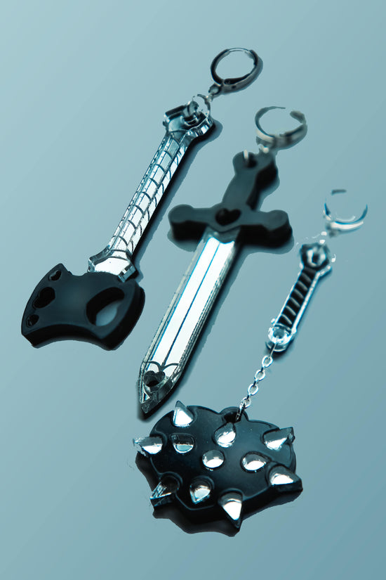 black weapon acrylic earrings on a blue background
